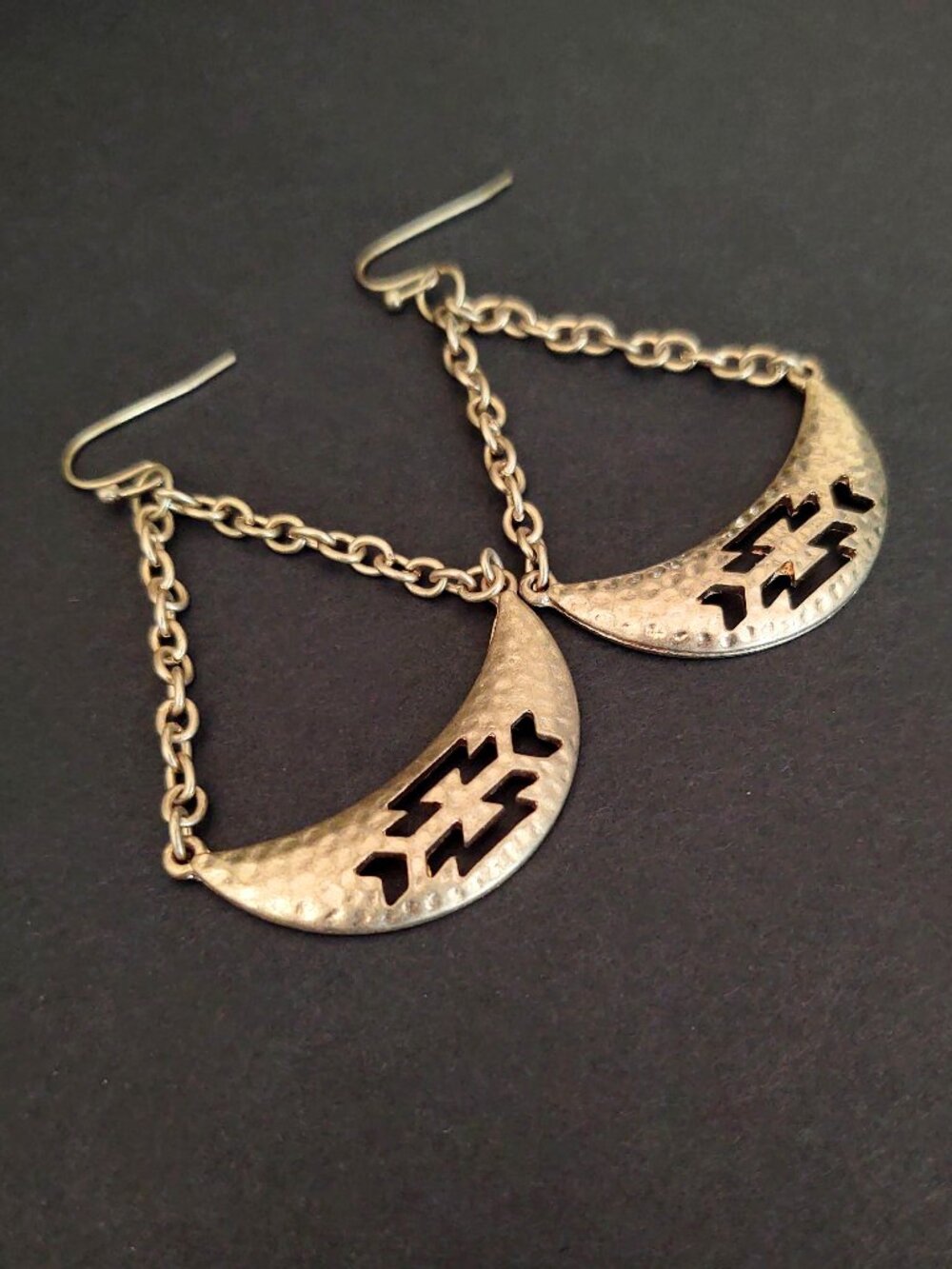 Hammered cut out metal earrings with chain detail